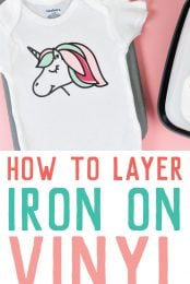 A white onesie with an image of a unicorn on it and advertising by HEYLETSMAKESTUFF.COM on How to Layer Iron On Vinyl