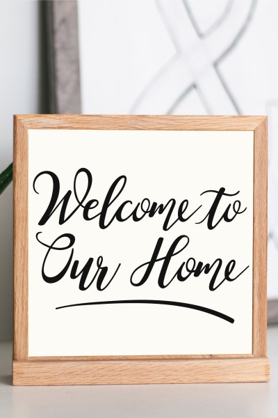 A wooden sign that says, "Welcome to Our Home"
