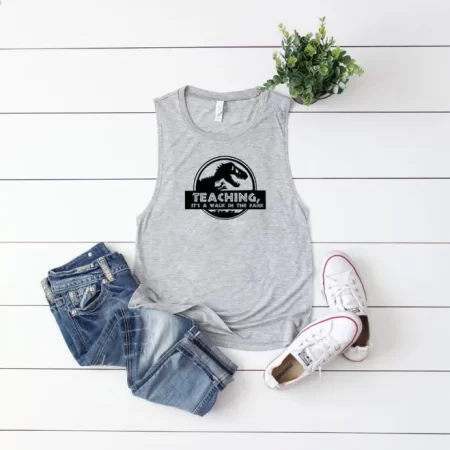 Gray tank top with an image of a dinosaur and the saying Teaching, Its A Walk In The Park
