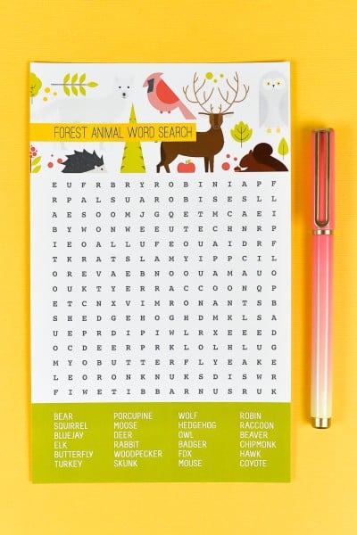A pen next to a Forest Animal Word Search paper