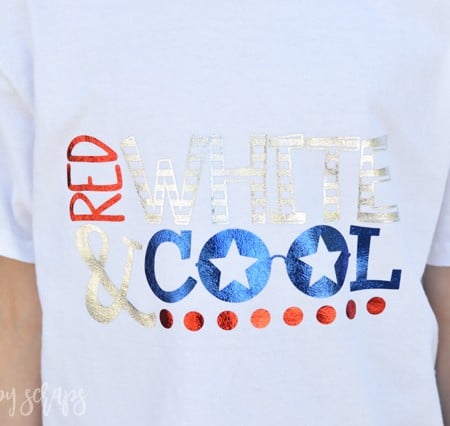 A person wearing a white t-shirt that says, "Red, White & Cool"
