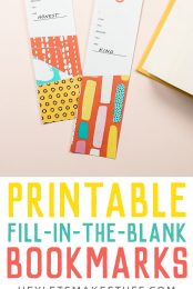 Two fill-in-the-blanks printable bookmarks alongside of an open book advertising free, printable, fill-in-the-blank bookmarks by HEYLETSMAKESTUFF.COM