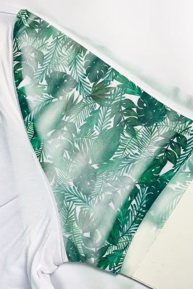 Image of greenery on a white piece of fabric