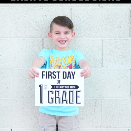 boy holding modern back to school sign