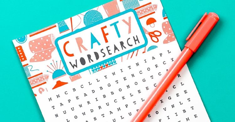 Close-up image of a Crafty Word Search and an orange pen