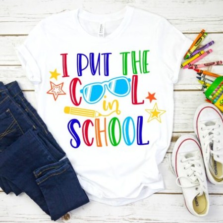 White t-shirt with the saying "I Put the Cool in School"