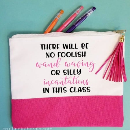 Pink and white pencil pouch with the saying, “There will be no foolish wand waving or silly incantations in this class”