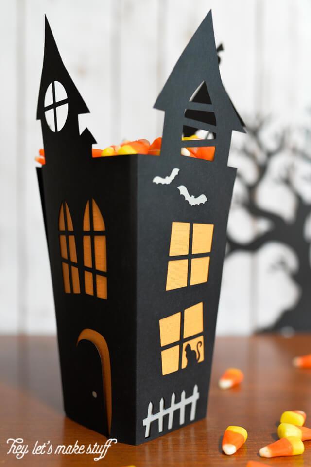 Create this Haunted House Cut Paper Candy Box from heyletsmakestuff.com and fill it up with your favorite Halloween treats.