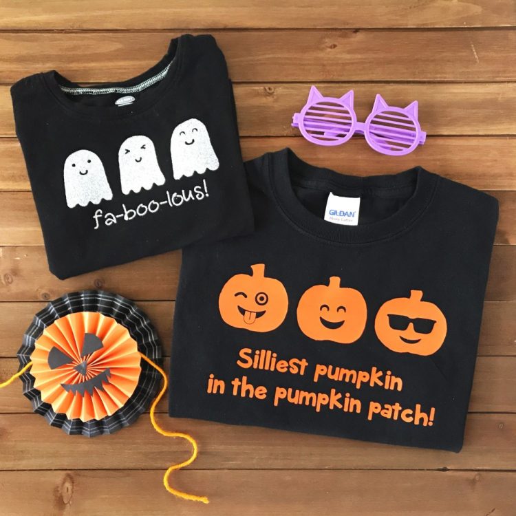 Halloween decor along with two black t-shirts, one decorated with white ghosts and the saying, \"fa-boo-lous!\" and the other decorated in orange pumpkins and the saying, \"Silliest Pumpkin in the Pumpkin Patch!\"