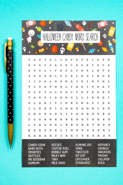 A pencil along-side of a Halloween Candy Word Search puzzle