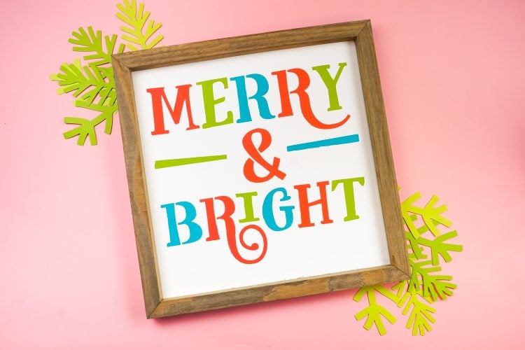Wooden framed sign that says Merry & Bright