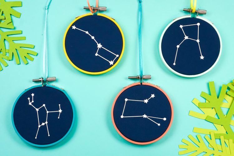 Images of Constellation Embroidery Hoop Christmas Ornaments with string attached to hoop for hanging