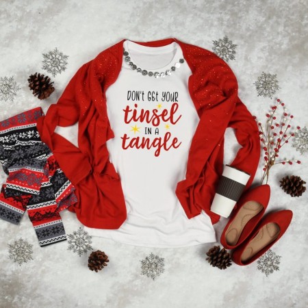 A red and white Christmas shirt with the saying Don't Get Your Tinsel in a Tangle