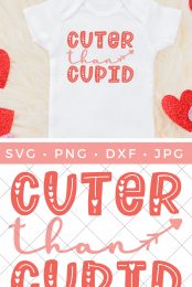White onesie surrounded by heart cutouts and the shirt has the saying "Cuter Than Cupid" on it