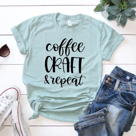 Light green t-shirt with the words Coffee Craft Repeat on it