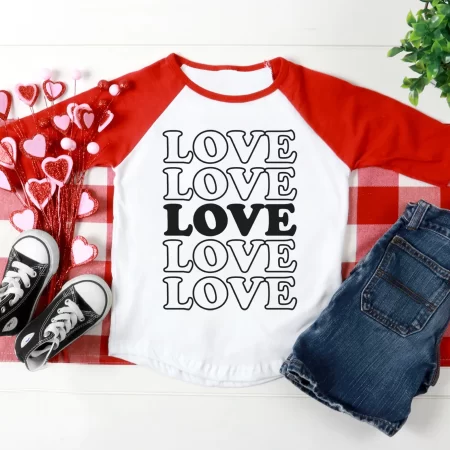 Red and white baseball style shirt with the word Love on it 5 times