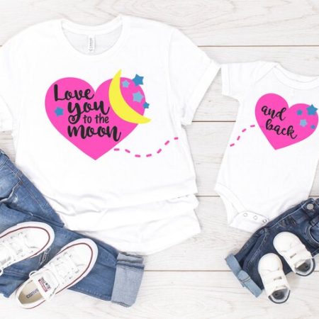 2 white t-shirts, one with a heart that says Love you to the Moon and the other one with a heart that says And Back