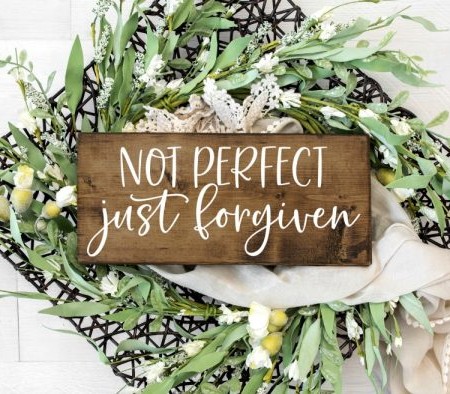 Wooden sign that says, Not Perfect Just Forgiven