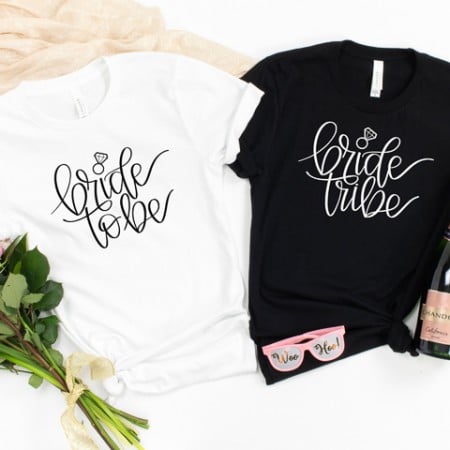White t-shirt that says Bride to Be and a black t-shirt that says Bride Tribe