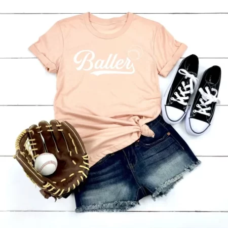 Peach colored t-shirt with a "Baller" SVG design