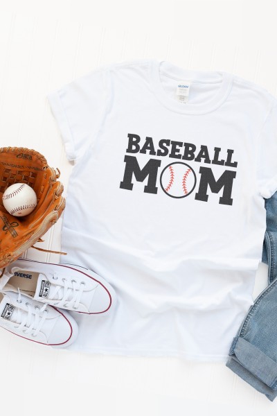 A pair of blue jeans, tennis shoes, baseball and glove and a white t-shirt with saying, 'Baseball Mom'.  The 'O' in Mom is a baseball image.