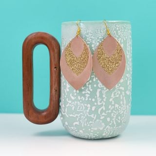 Make a fashion statement—using scraps from your craft room! These glitter and suede earrings are super easy to make using your Cricut. Get the free Cricut earrings SVG, too!