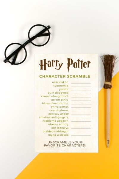 A pair of glasses and a pen next to a printed Harry Potter Character Scramble