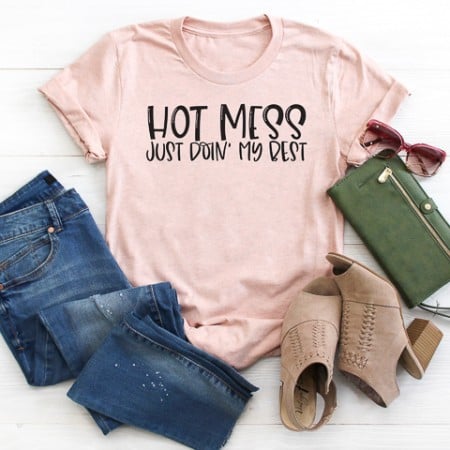 Light pinkish t-shirt that says, Hot Mess Just Doin' My Best