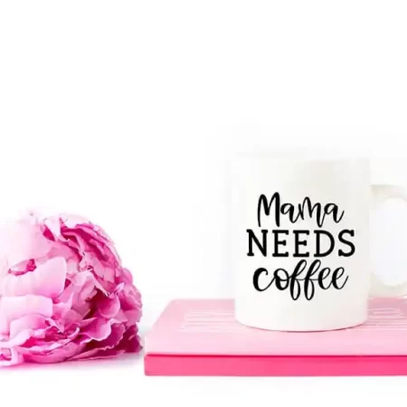 White coffee mug that says Mama Needs Coffee