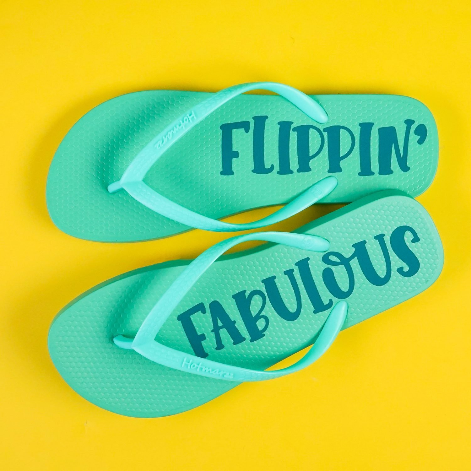 Finished flip flops on yellow background.