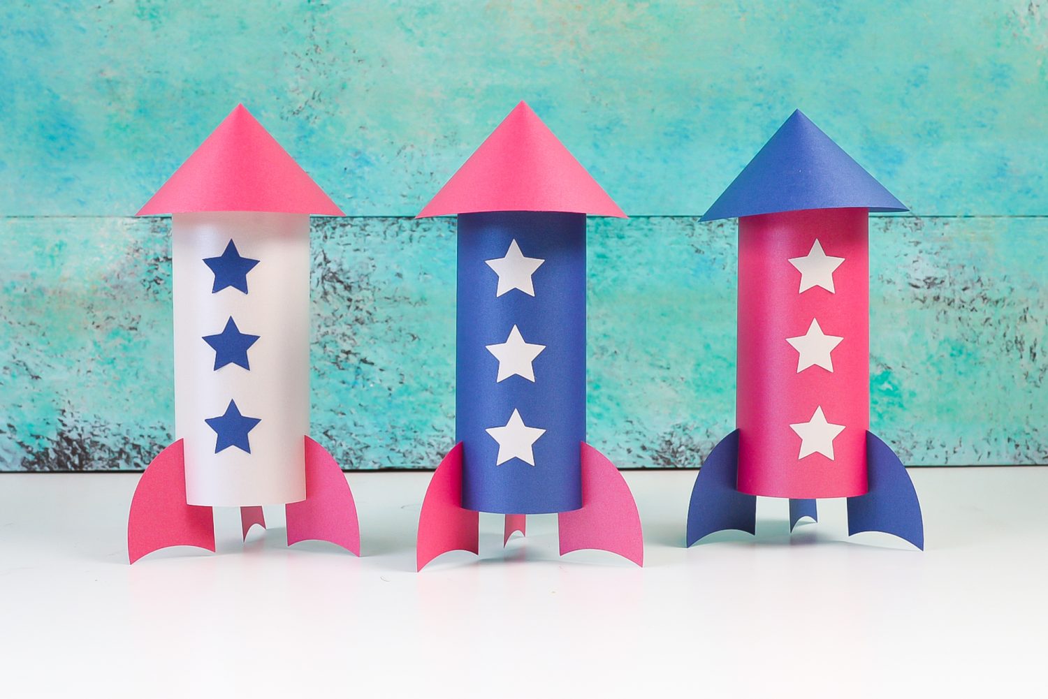 Picture of three paper rockets made out of red, white and blue paper