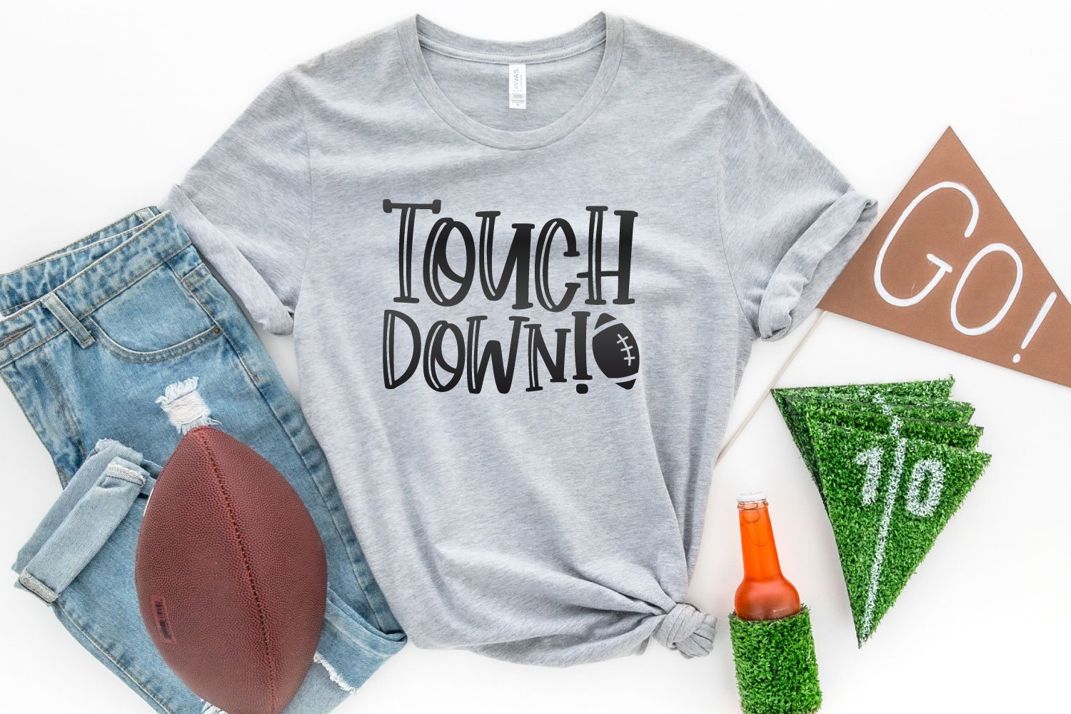 Touchdown SVG on a gray shirt with football accessories