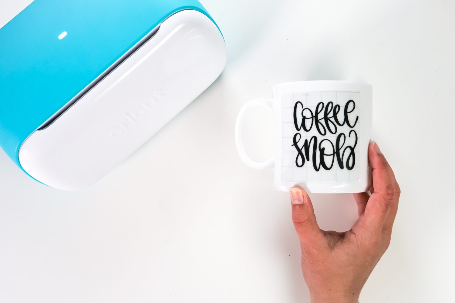 Coffee Snob decal on mug with transfer tape.