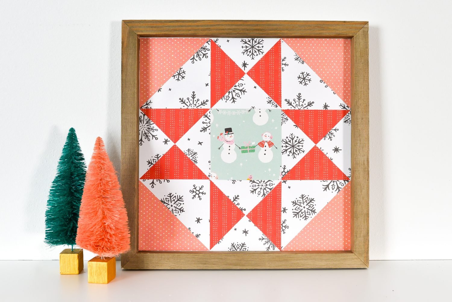 Christmas Paper Quilt Block on shelf with faux tree decor