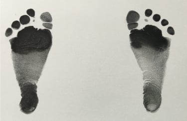 Phone image of newborn footprints