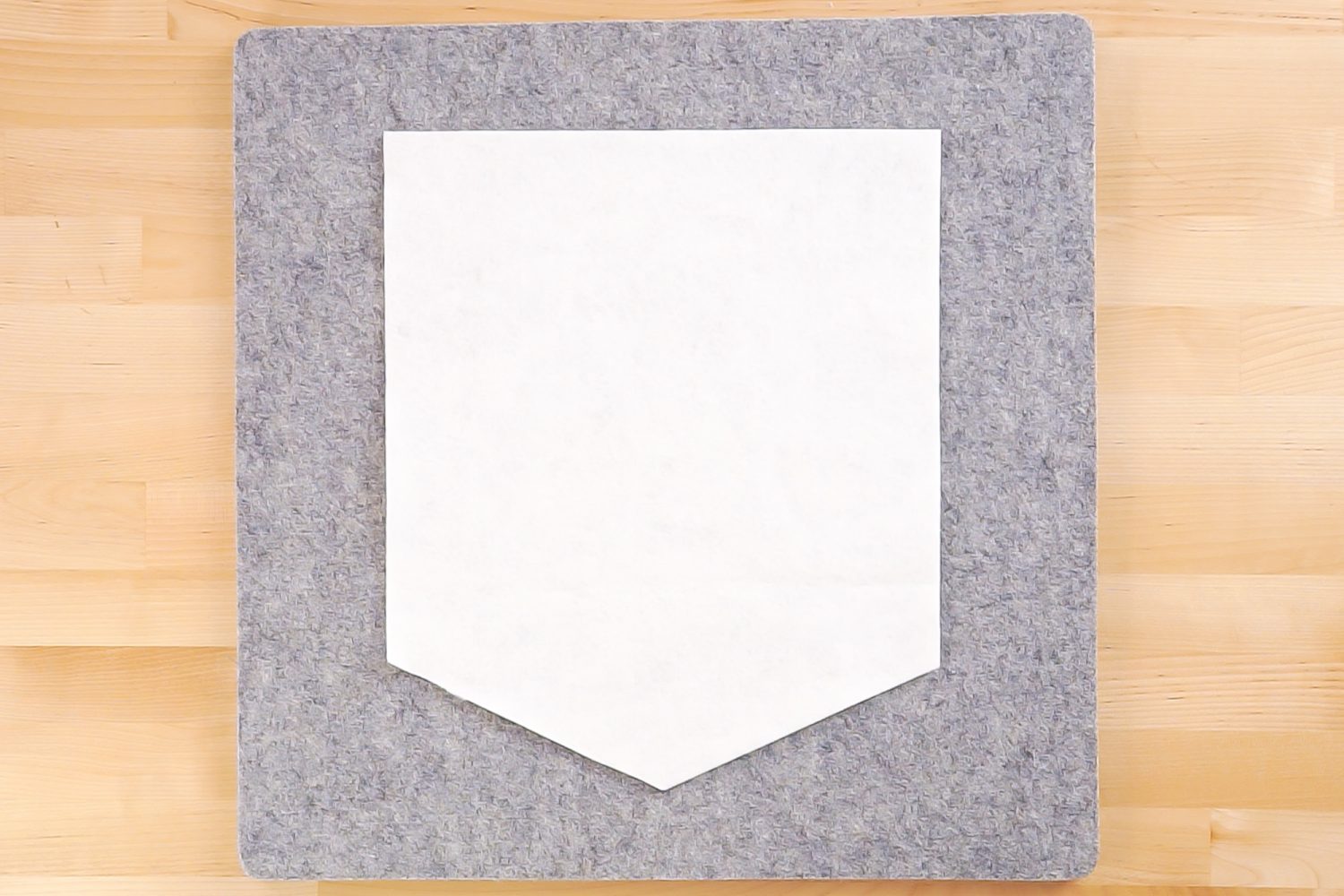 White felt pennant after cutting.