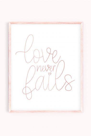 Love Never Fails artwork in pink frame