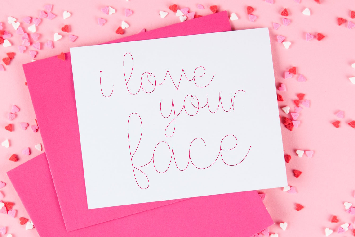 "love your face" card with pink single-line font foil writing