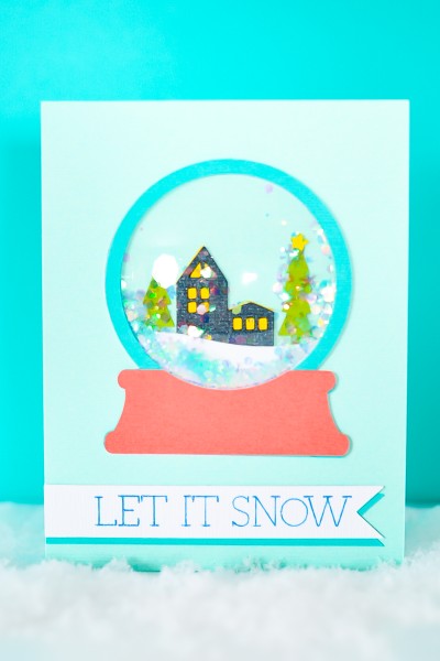 Picture of the outside of the completed Snow Globe Shaker Card with quote "Let It Snow"