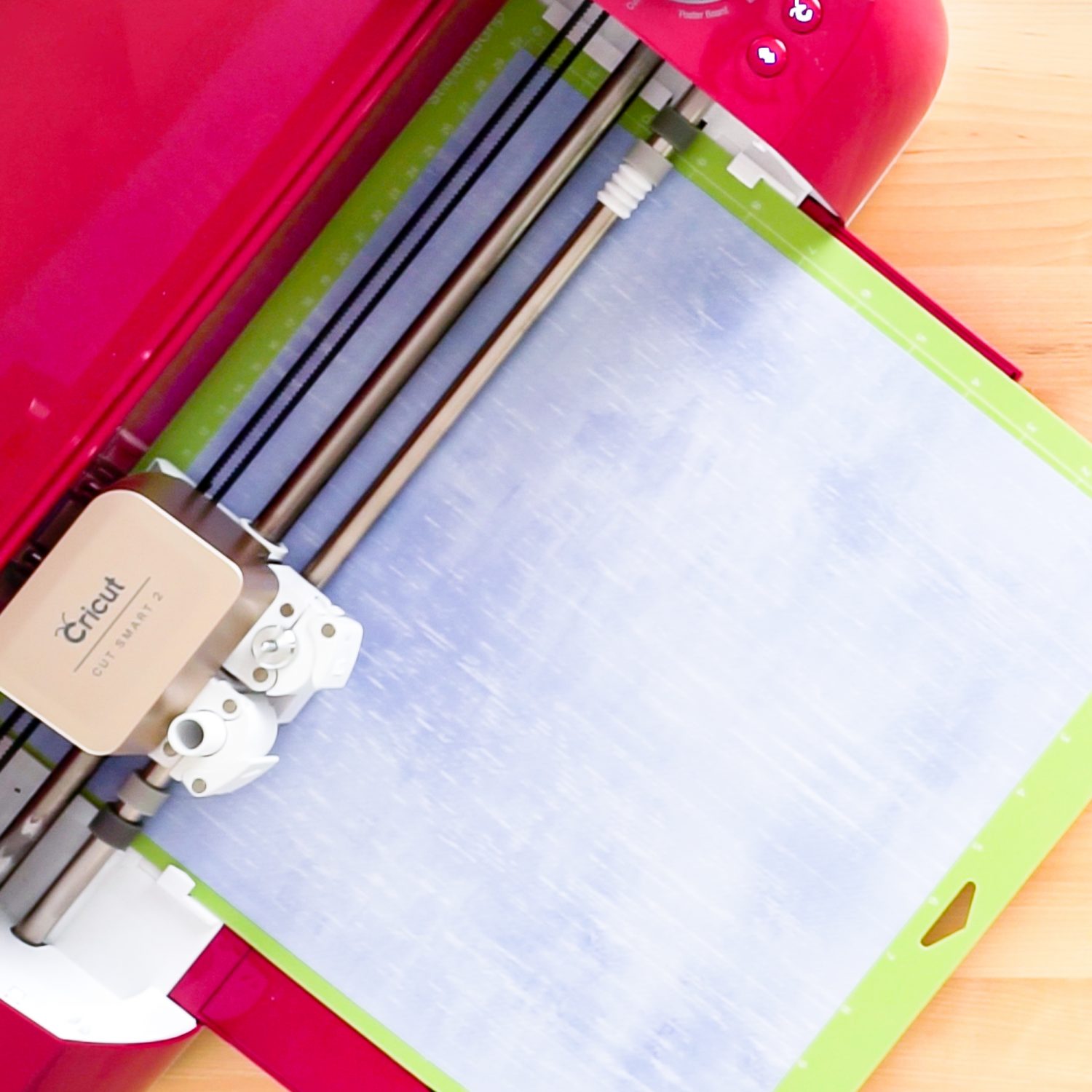 Cricut Explore machine cutting Infusible Ink transfer sheet.