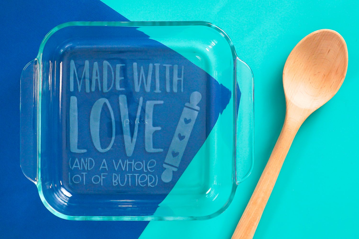 Finished baking dish on blue background with spoon.