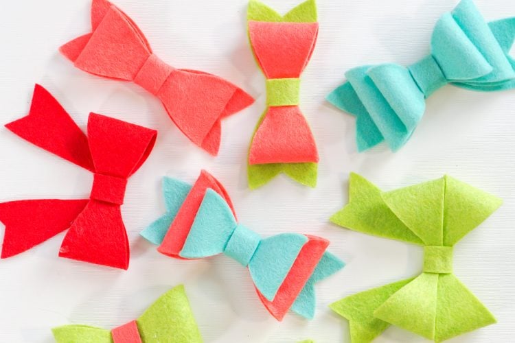 Image of completed felt bows in red, aqua and green colors