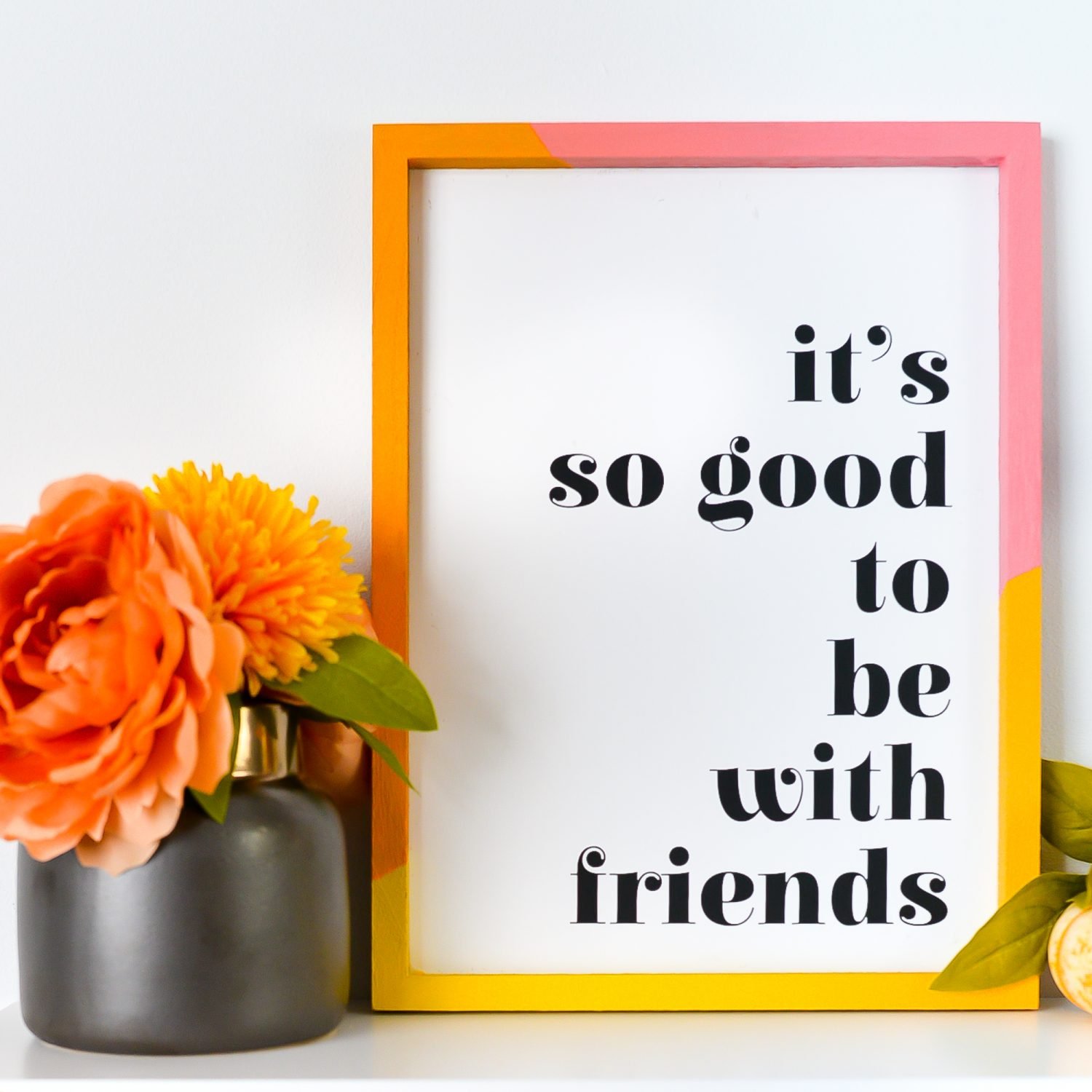 Closeup of "it's so good to be with friends" sign