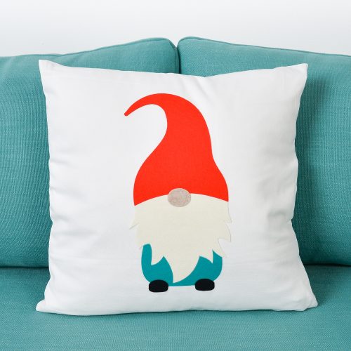 Gnome pillow on blue couch