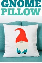 Gnome pillow on an aqua colored sofa