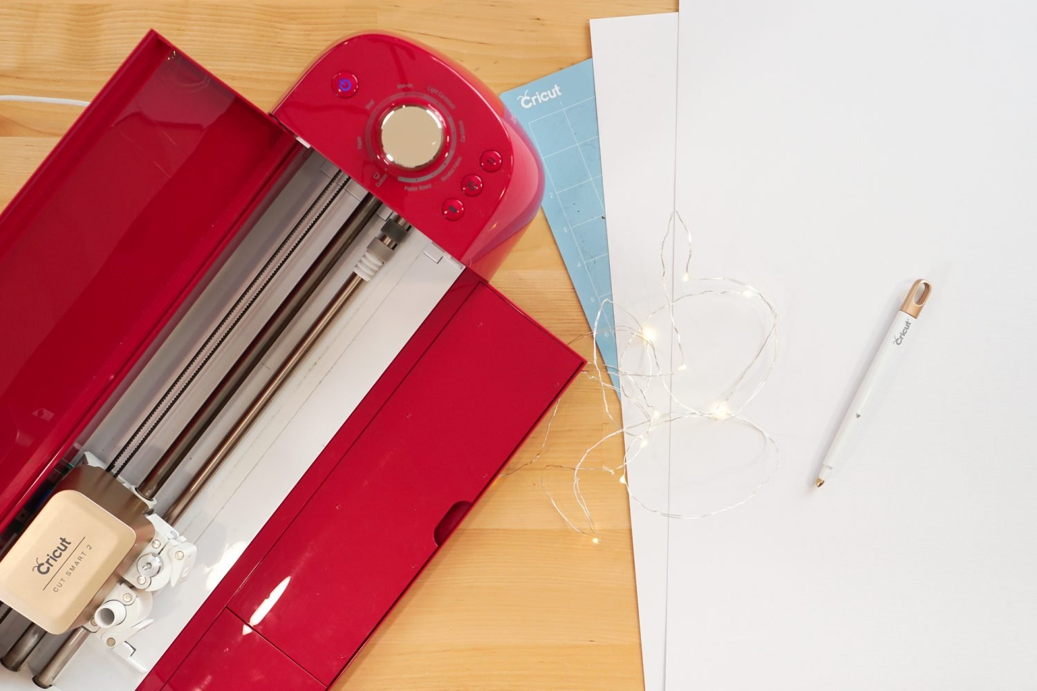 Supplies needed for this project: Cricut Explore, 12" x 24" cutting mat, 12" x 24" white cardstock, scoring stylus, fairy lights