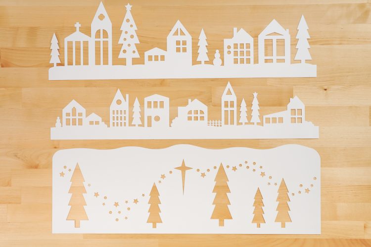 Three layers of the papercut Christmas village