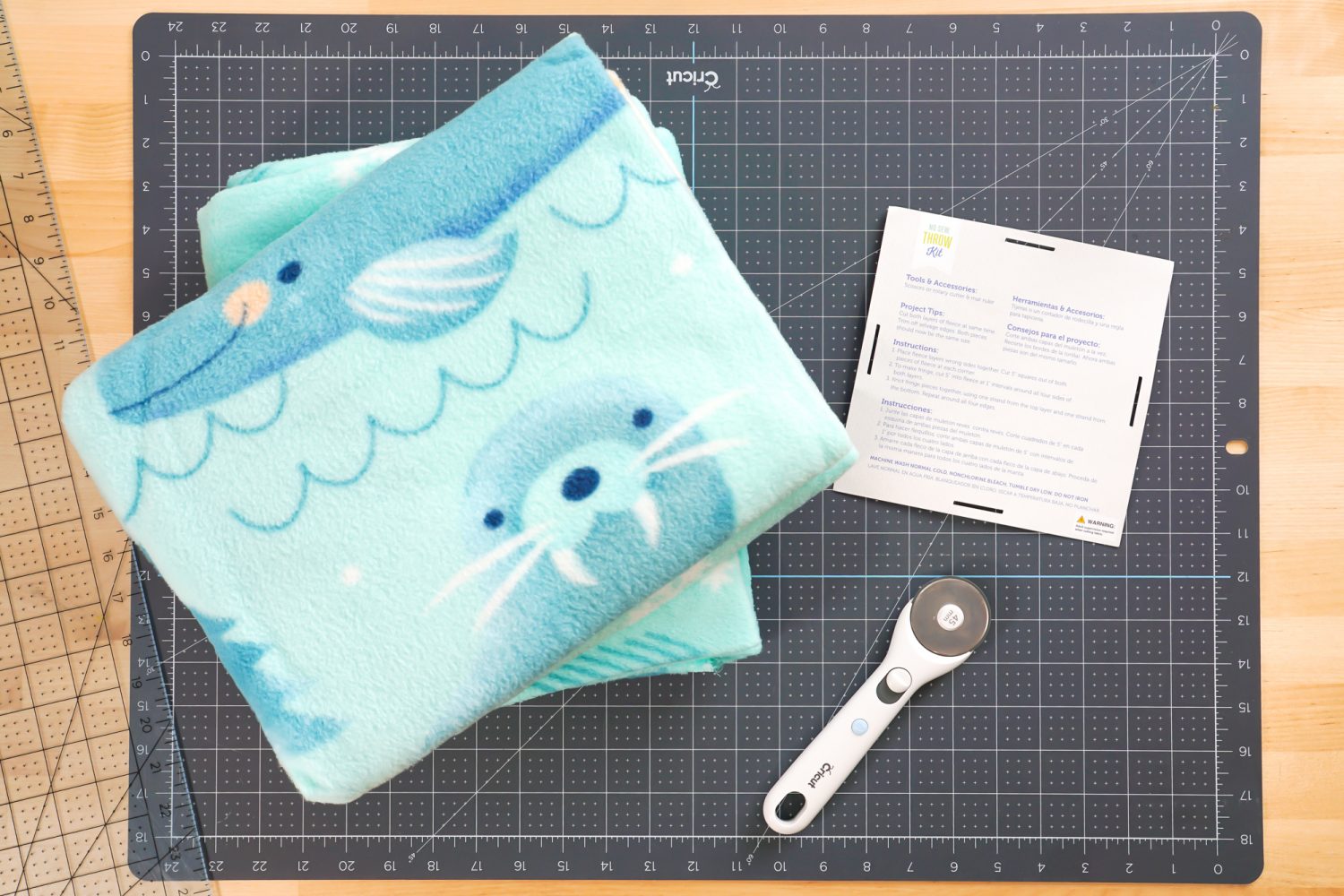 Fleece blanket kit with rotary cutter and instructions from tag