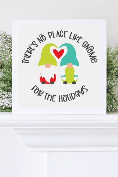 "There's No Place Like Gnome for the Holidays" image on white sign with holiday greenery
