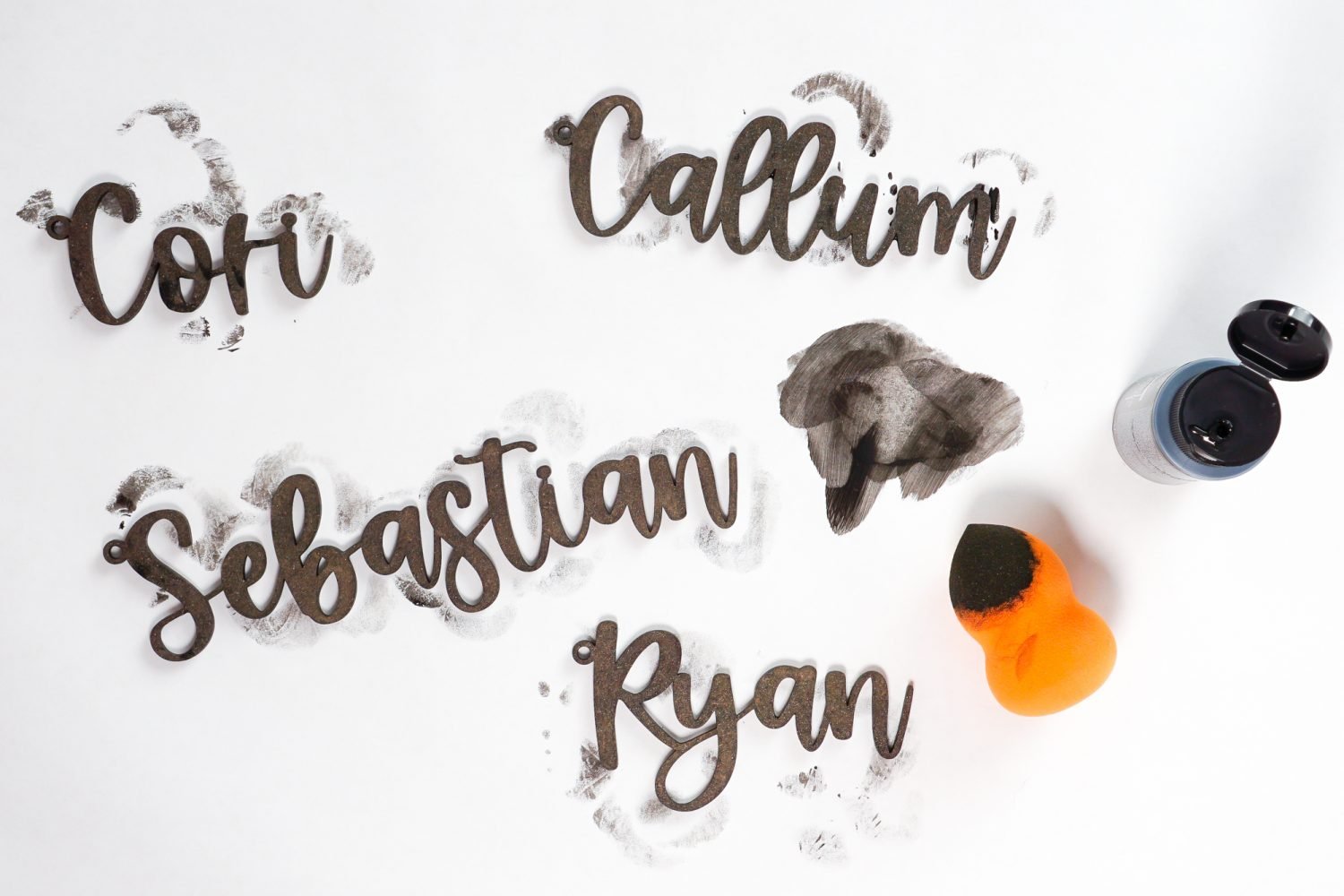 Painting names with makeup sponge
